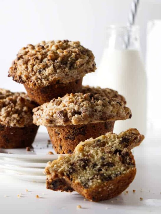 chocolate chip muffins with a bottle of milk in the background