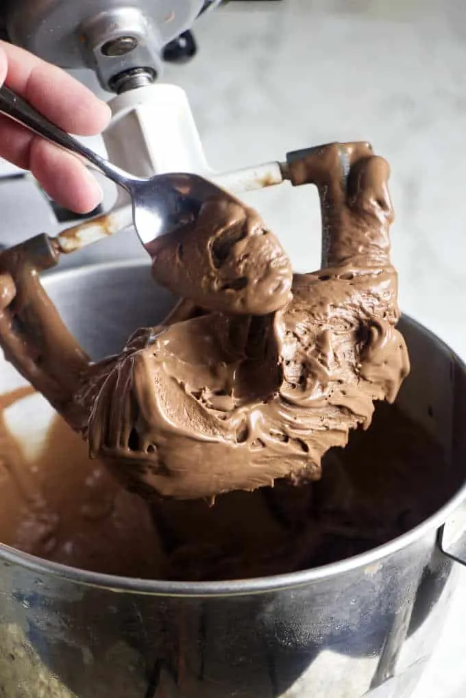 dipping a spoon into chocolate ice cream