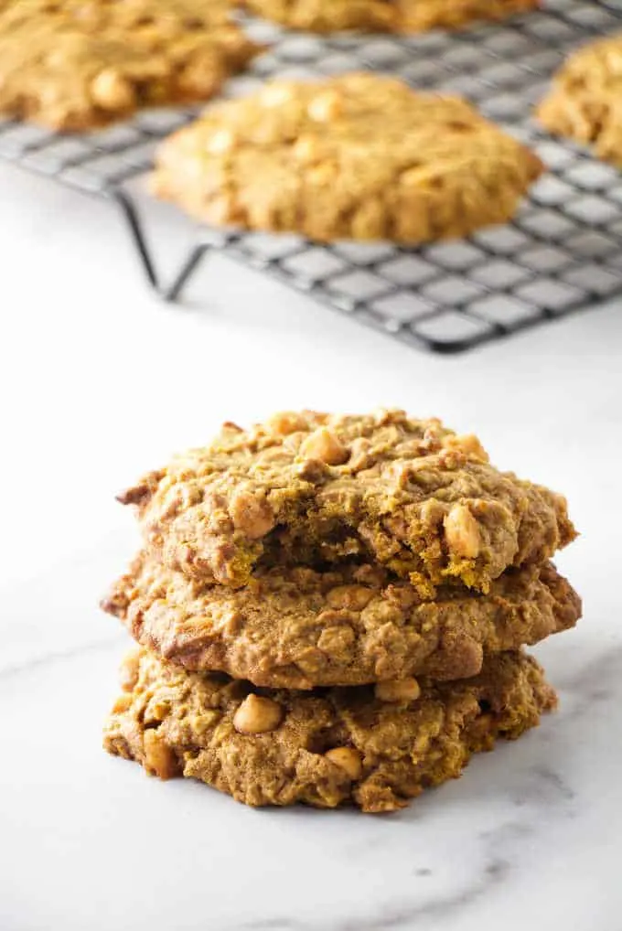 Stack of chewy pumpkin oatmeal cookies with butterscotch chips in them.