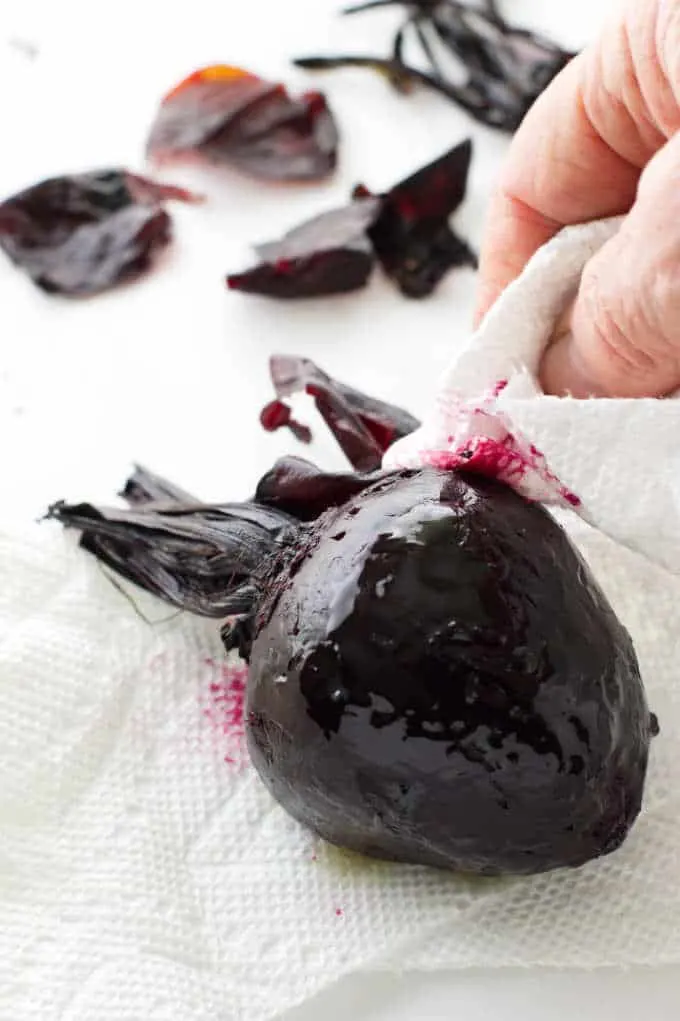 Rubbing the skin off a roasted beets