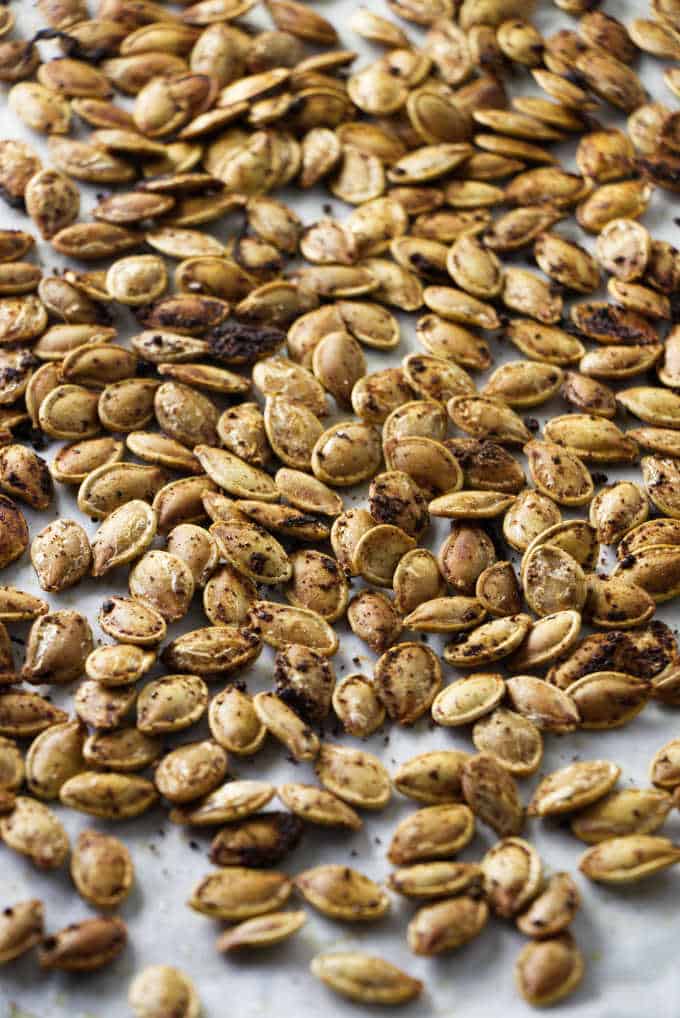 close up of seasoned roasted pumpkin seeds.