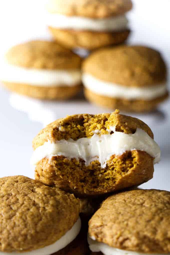 close up photo of pumpkin whoopie pies with cream cheese frosting