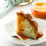 Serving of cauliflower with Buffalo Sauce being spooned on, napkin in background