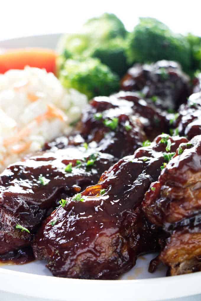 Country style pork ribs with broccoli in the background