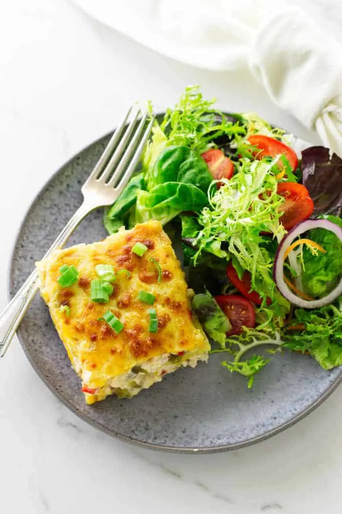 Overhead view of a serving of casserole and salad