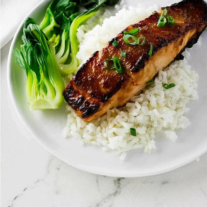 Miso glazed salmon on a bed of white rice.