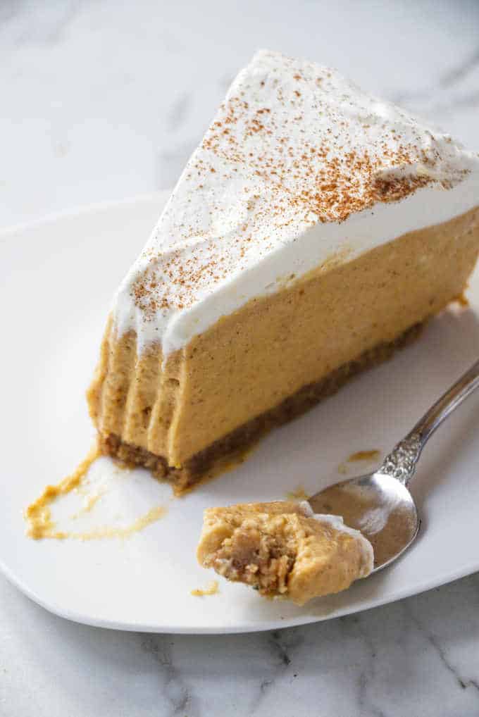 overhead view of a partially eaten no-bake pumpkin cheesecake