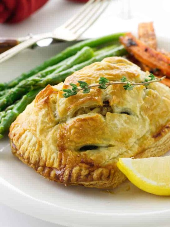 Close up of a serving of salmon and crab wellington