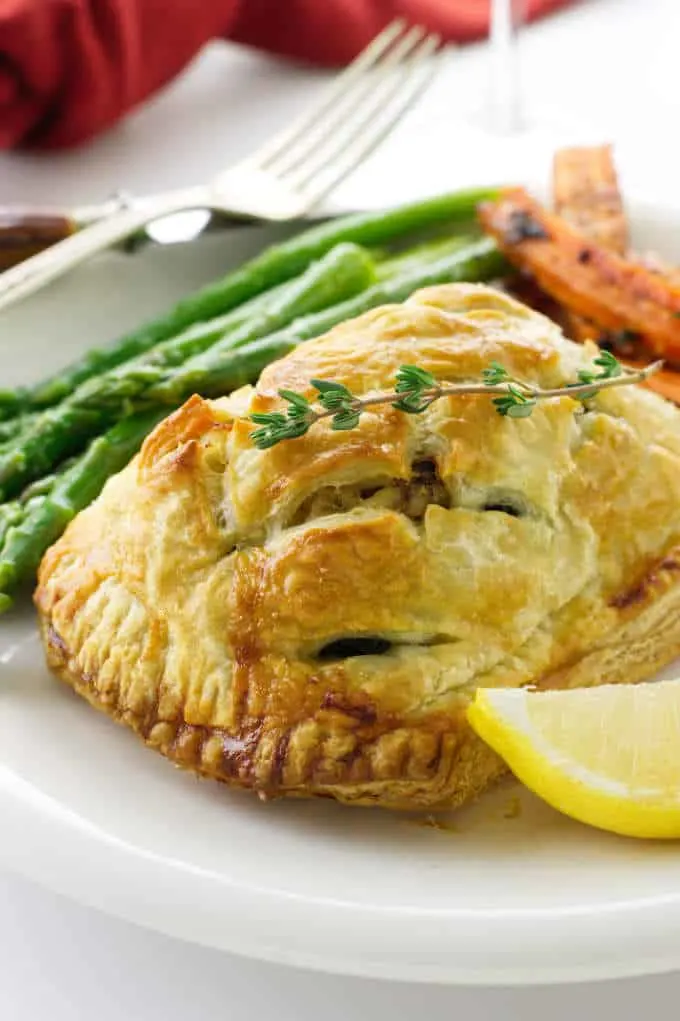 Close up of a serving of salmon and crab wellington