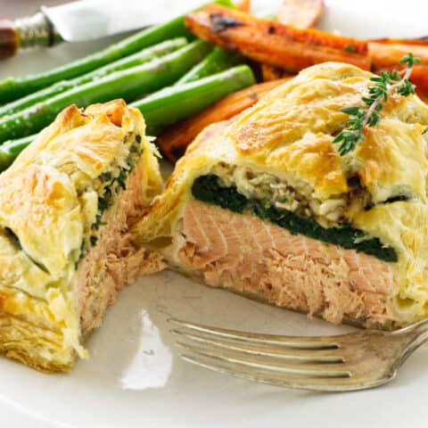 Close up serving of salmon and crab wellington