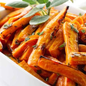 Dish of honey roasted carrots with sage