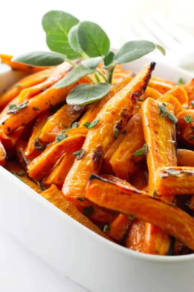 Dish of honey roasted carrots with sage