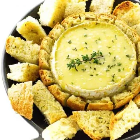 Plate of baked brie with bread dippers