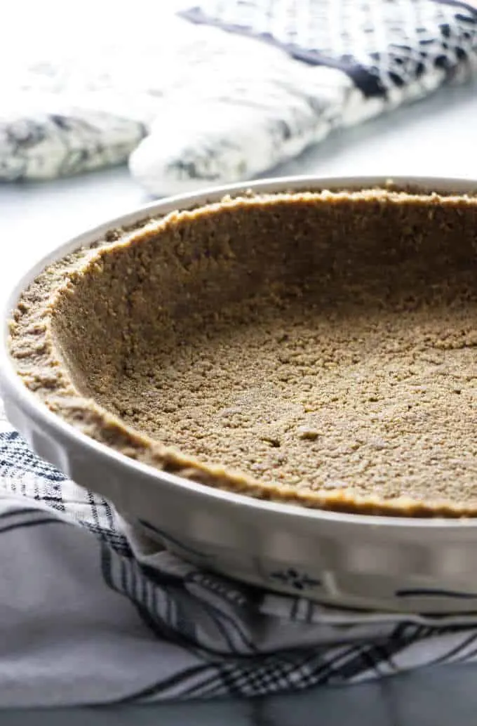 Brown sugar pecan pie crust in a pie plate.