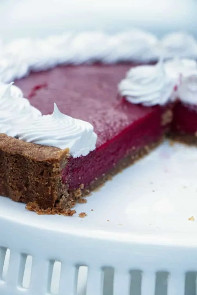 Cranberry curd tart on a cake plate