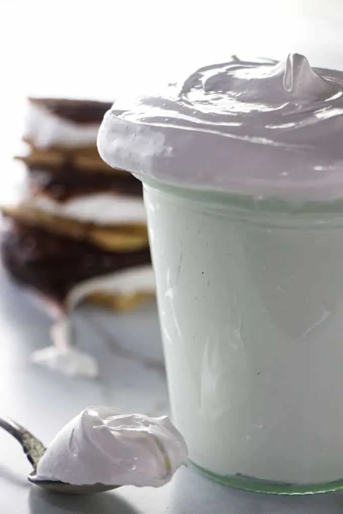 An overflowing jar of homemade marshmallow fluff.