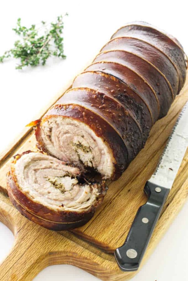 Porchetta on cutting board with knife