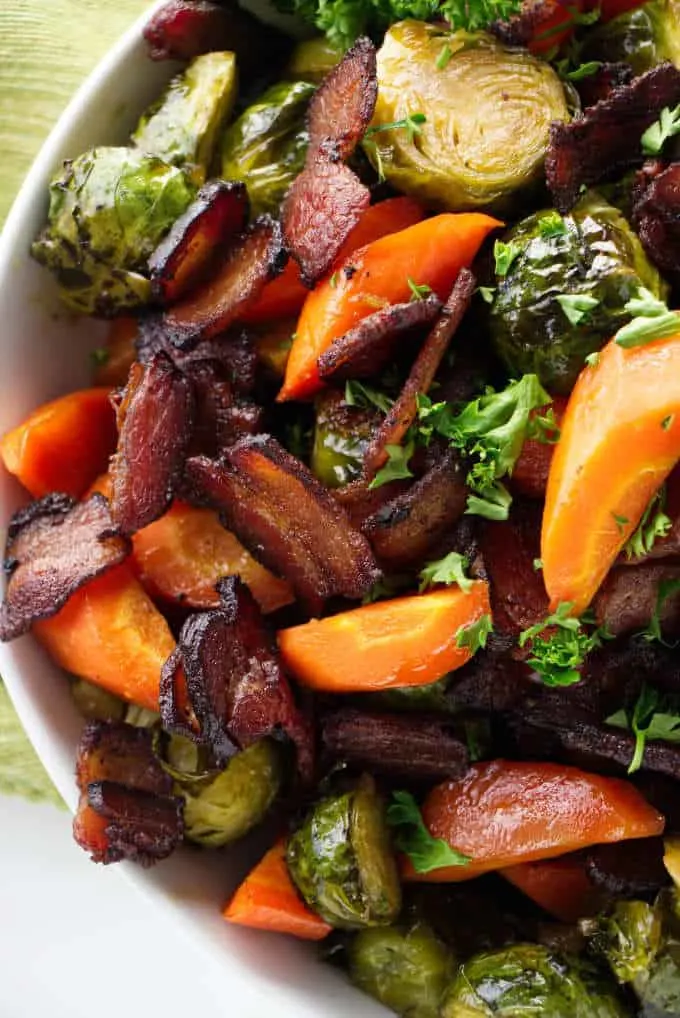 roasted brussel sprouts and carrots in a serving bowl.