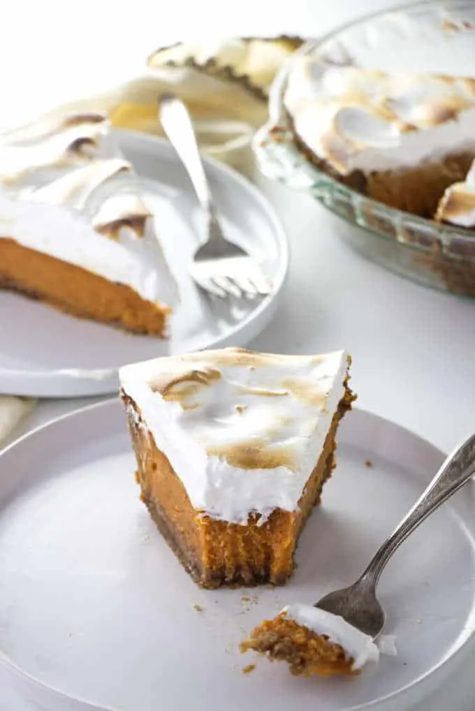 Two slices of Southern sweet potato pie next to a pie plate.