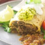 A close up photo of a shredded beef chimichanga.