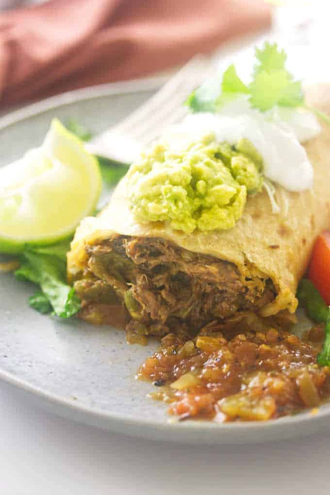 A close up photo of a shredded beef chimichanga.