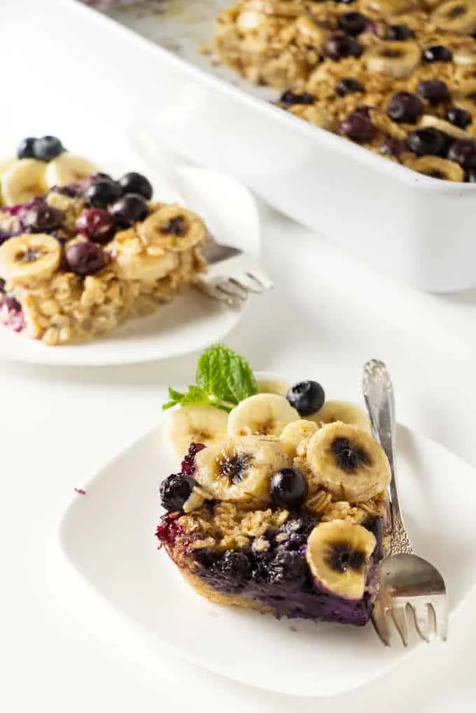 Two serving plates with slices of baked oatmeal.