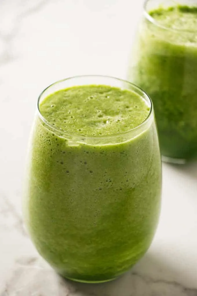 A glass filled with a green power smoothie.