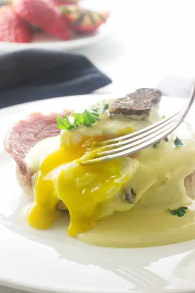 Slicing into the yolk of an egg with Truffled Hollandaise Sauce.