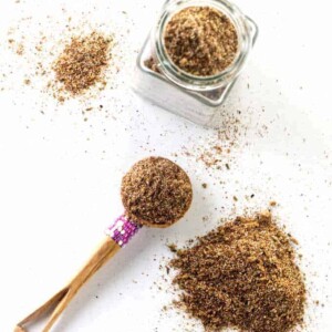 Homemade taco seasoning in a spice jar.