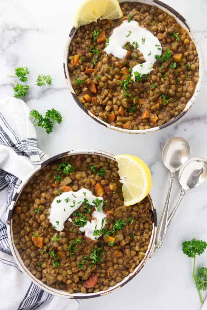 Overhead photo of lentil soup and spoons.