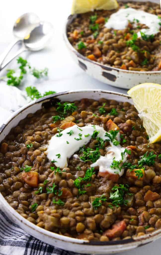 Two bowls of lentil soup made in an Instant Pot.