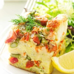 Close up view of a serving of strata, fork on plate