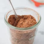 A jar of cajun seasoning mix.