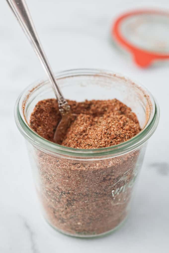 A jar of cajun seasoning mix.