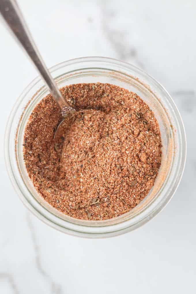 A jar of cajun seasoning mix.