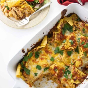 A casserole dish with tortilla chip casserole in it.