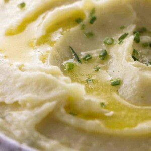 Buttermilk ranch mashed potatoes with melted butter and chives on top.