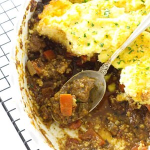 Overhead view of ossobuco casserole and serving spoon