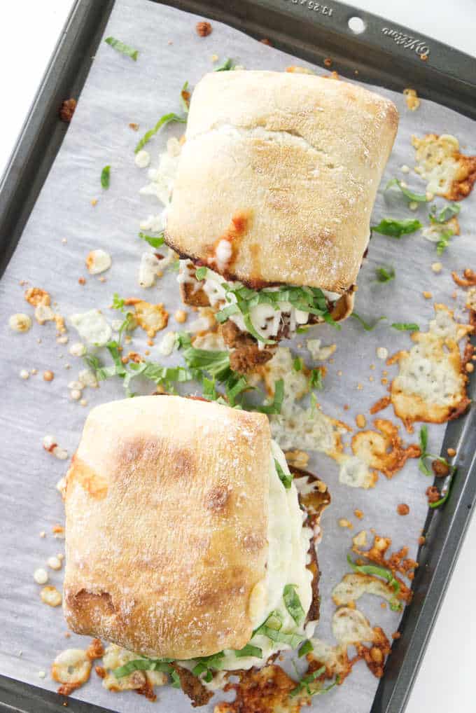 Overhead photo of 2 hot meatloaf sandwiches on a baking tray.