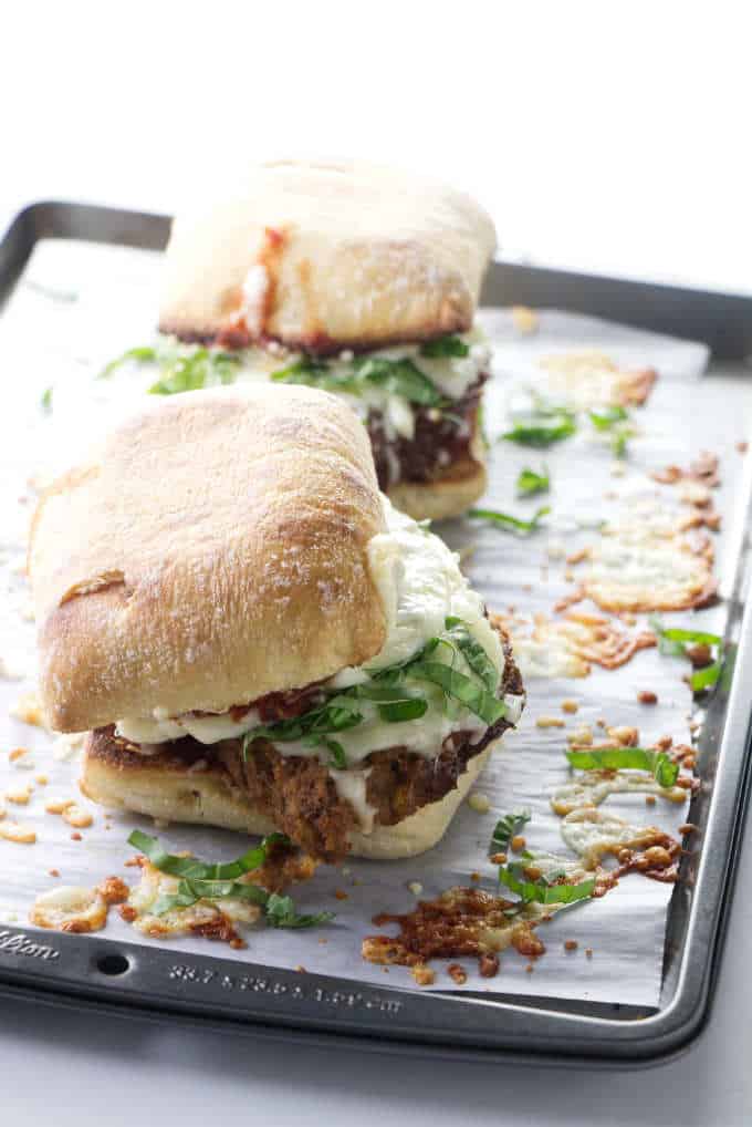 Two hot meatloaf sandwiches on a baking tray.