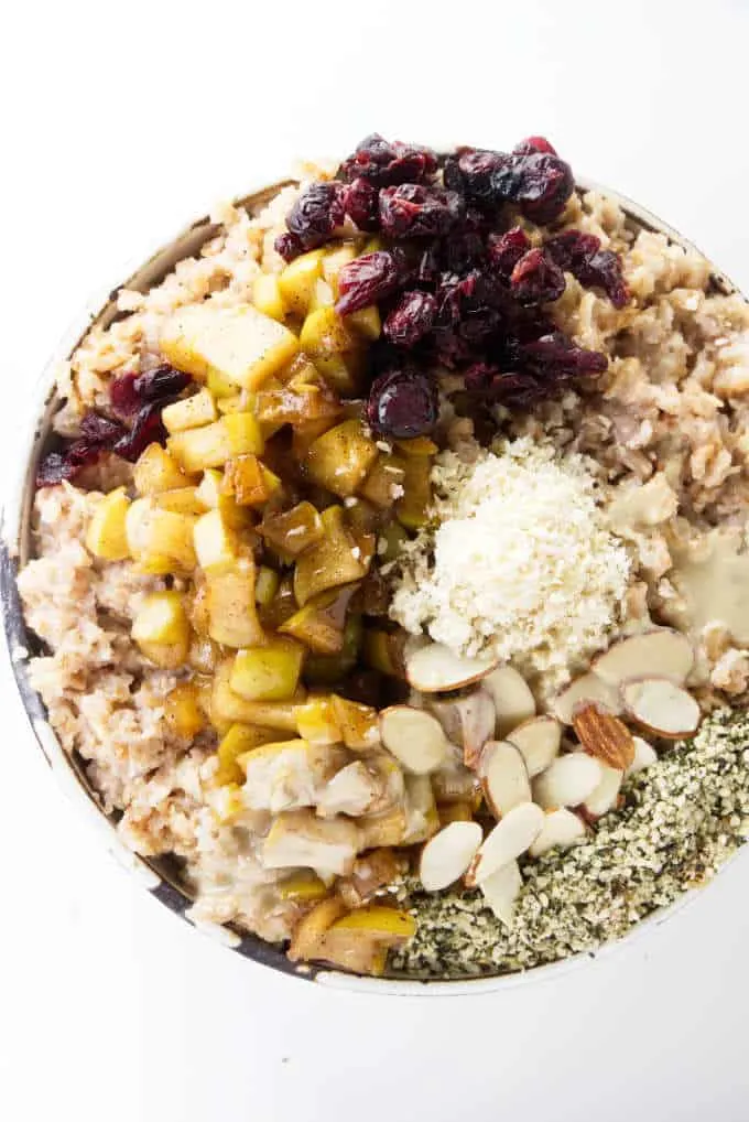 An overhead photo of hot rolled spelt cereal with toppings.