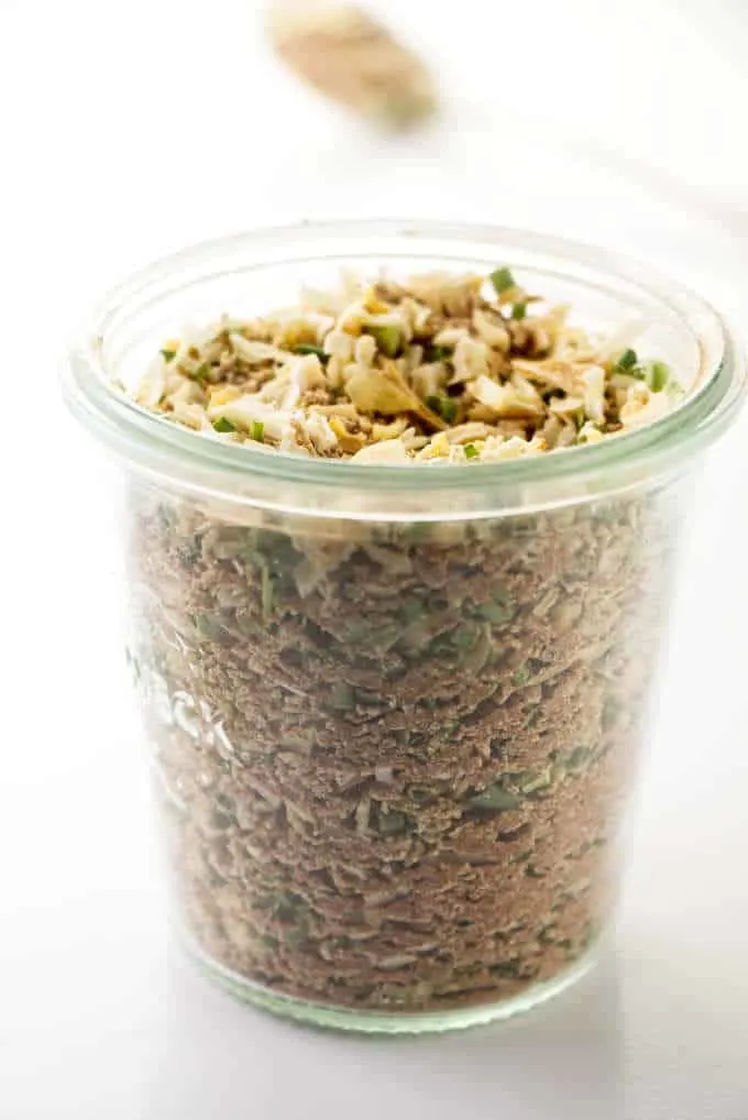 A jar filled with onion soup mix.