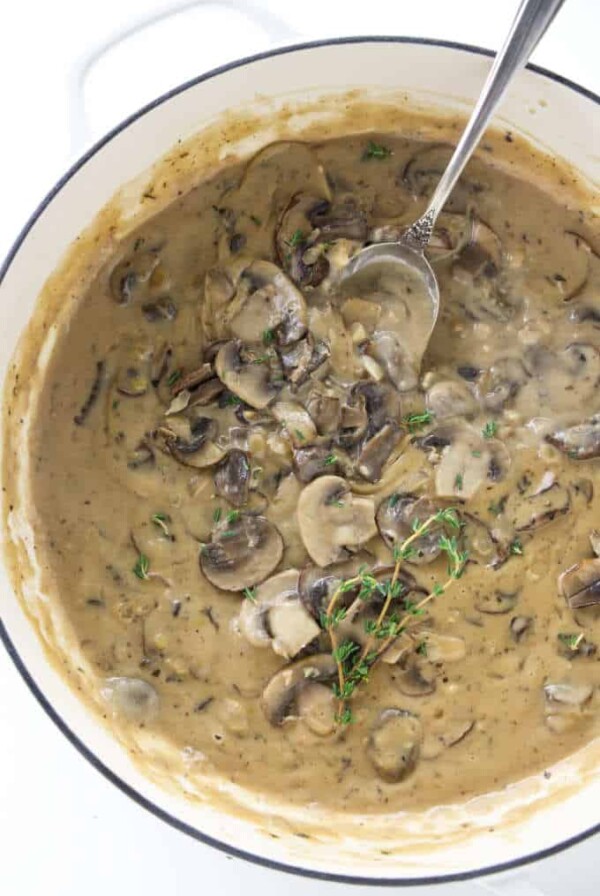 A skillet with mushroom marsala sauce inside.