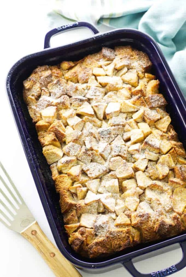 casserole of baked french toast and apples, dusted with confectioner's sugar