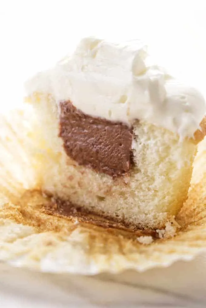 Chocolate filling inside a cupcake.