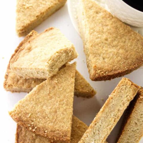 Slices of oatmeal shortbread and a cup of coffee.