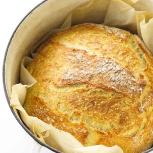 Baked loaf of bread in a Dutch oven