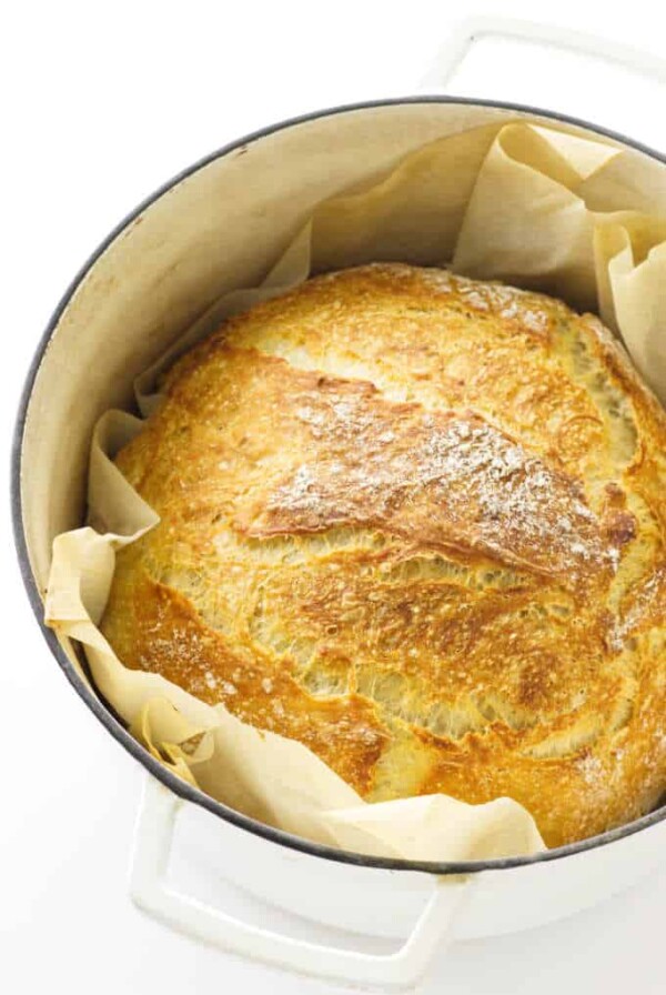 Baked loaf of bread in a Dutch oven