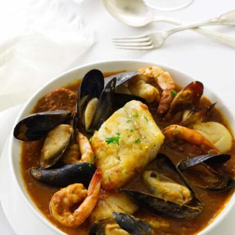 Seafood stew of mussels, scallops, shrimp, chorizo sausage and Pacific cod in a spicy sauce