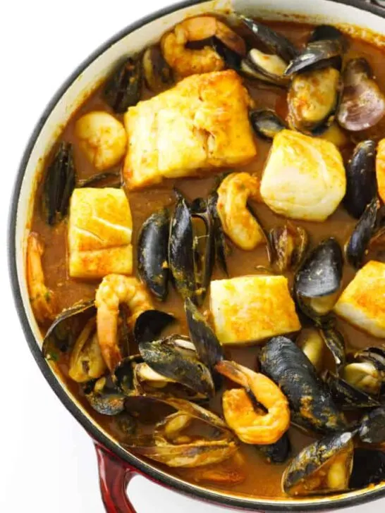 Large pot of seafood in a spicy sauce
